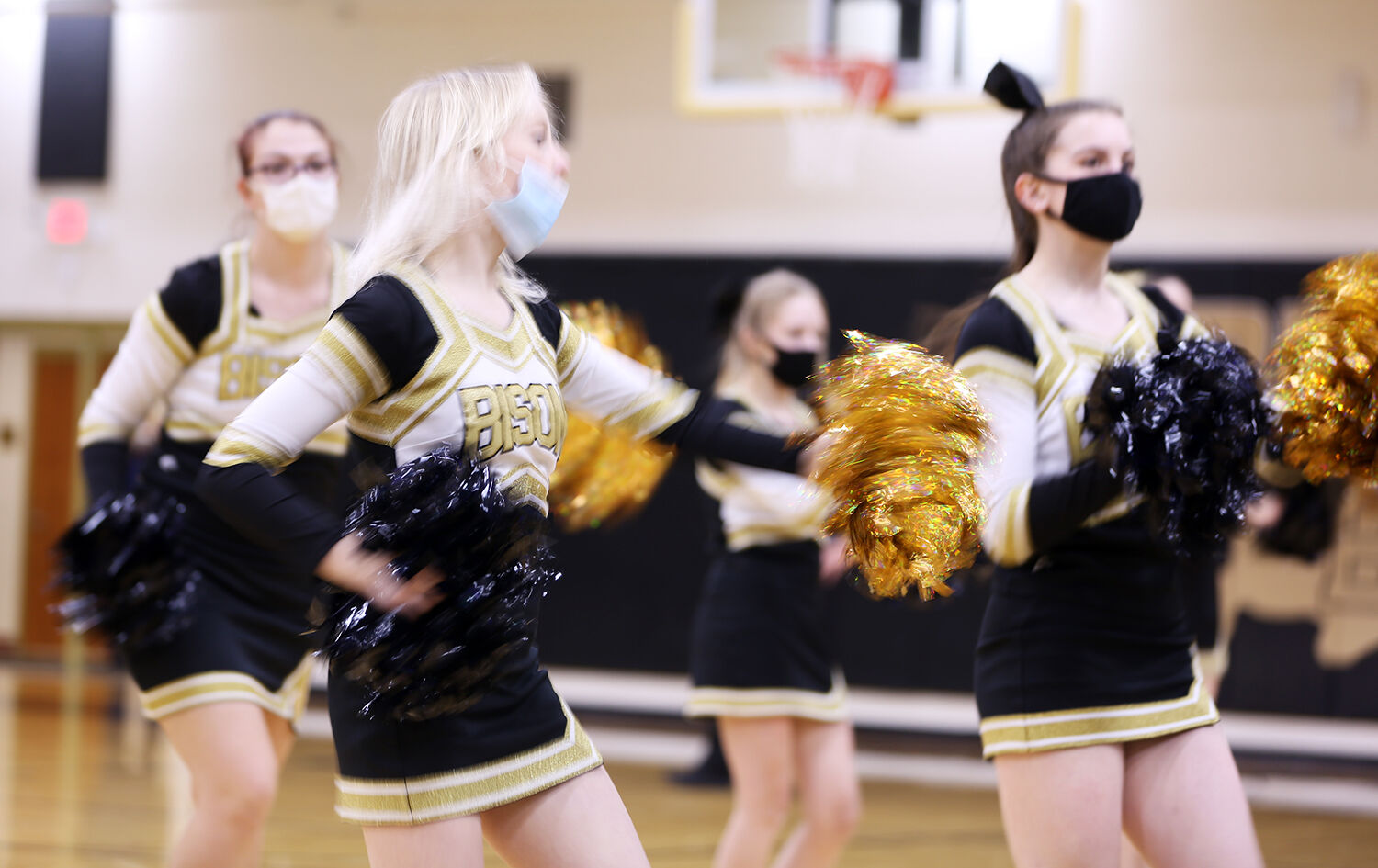 Buffalo High School’s cheerleaders coordinate with the pep band